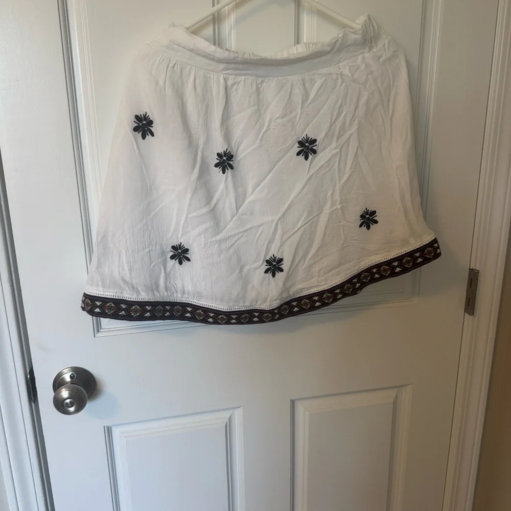 A. Peach White Embroidered Skirt with Decorative Hem
